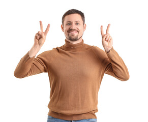 Handsome man showing victory gesture on white background