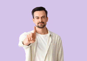 Handsome man on lilac background