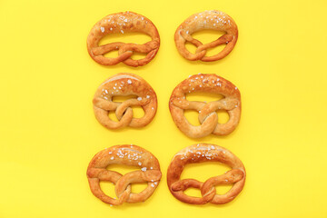 Soft pretzels on yellow background