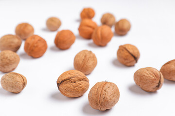 Whole walnuts on white background