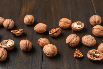 Natural walnuts on wooden background
