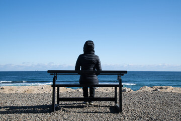 Fototapeta premium a woman looking at the sea