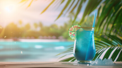 Refreshing blue lagoon cocktail in tropical paradise with blurred beach background