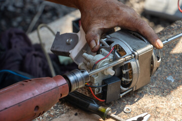 Repair of the fan at the garden table, close up