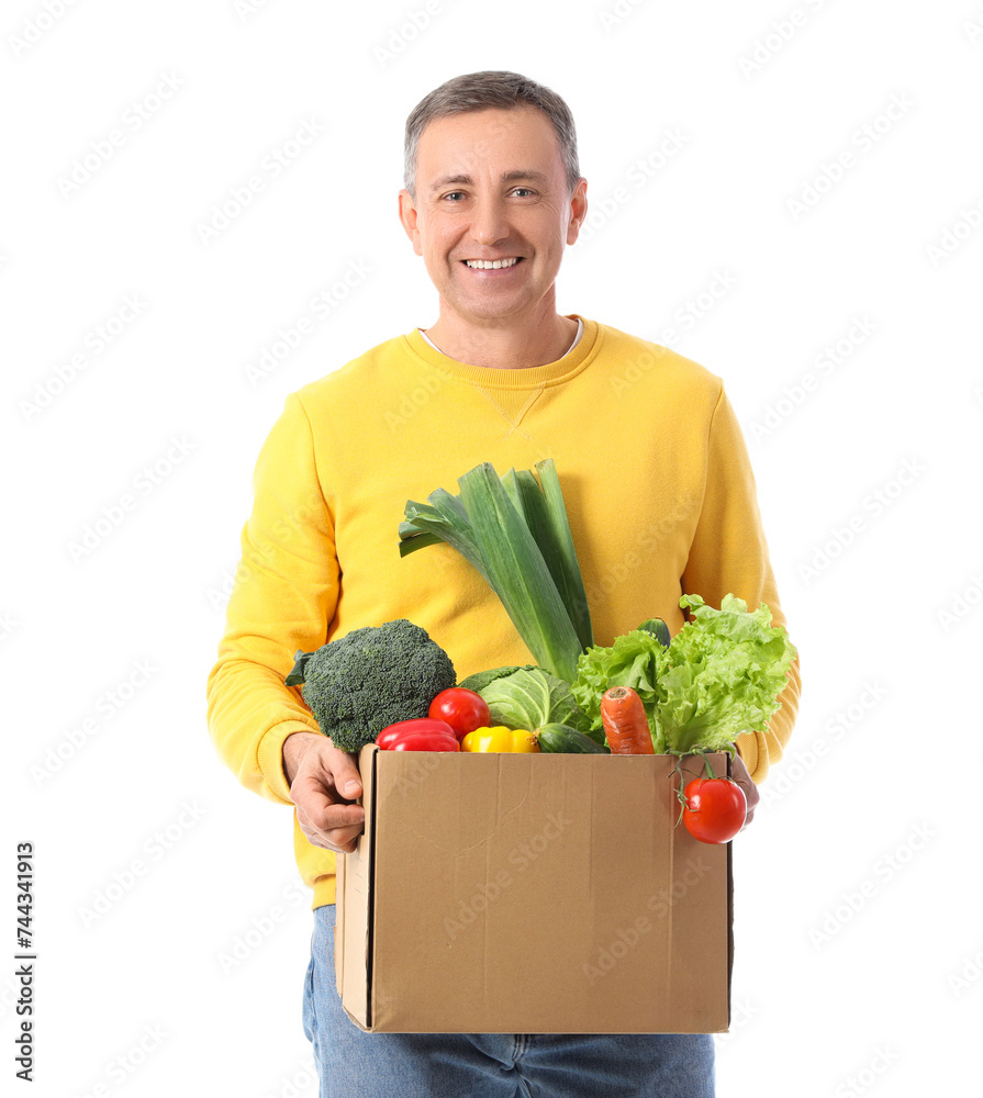 Canvas Prints Mature man with box of fresh vegetables on white background