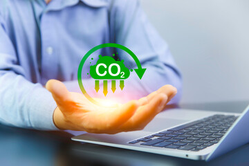 green energy concept help reduce global warming. Carbon reduction sign on hand. Carbon dioxide emission in industry net zero carbon neutrality in 2050.