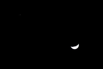 half moon and mars in the sky