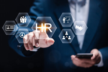 HR, Human Resources management concept. Recruitment, Employment, Headhunting, Team building. Businessman touching HR icon on virtual screen.