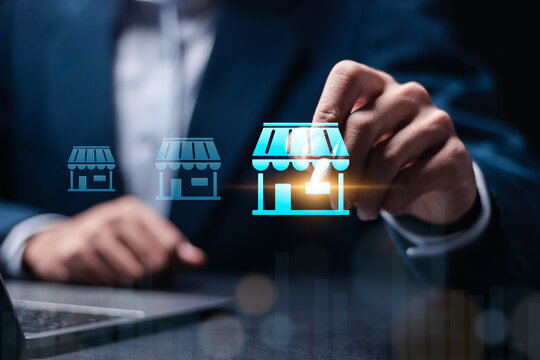 Franchise business concept. Businessman use laptop with franchise marketing system on virtual screen for global network connection.