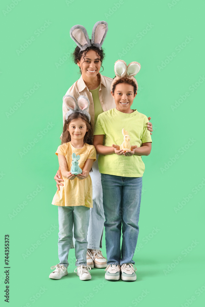 Sticker happy family in bunny ears with easter rabbits on green background