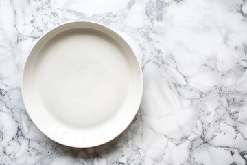empty white plate on marble table