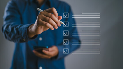 Business performance checklist, businessman using phone doing online checklist survey, filling out digital form checklist, take an assessment, questionnaire, evaluation, online survey, online exam.