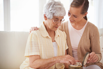 Mother, old woman and adult daughter with pearl necklace, home and conversation in a lounge....