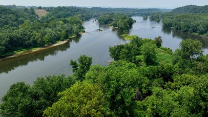 Fototapeta na wymiar Potomac river gently flowing in peaceful countryside in Maryland, Virginia state line