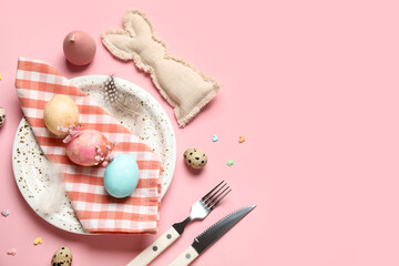 Beautiful table setting with Easter eggs and gypsophila flowers on pink background