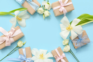 Spring frame made of wrapped gift boxes and flowers on cyan background