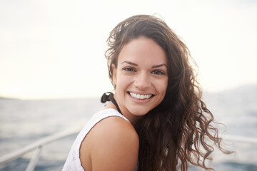 Woman, portrait and smile on yacht in outdoors, happy and travel to ocean on summer holiday. Female...