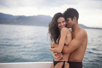 Couple, yacht and embrace on ocean on vacation, love and relax by water on summer holiday. People, cruise and bonding for relationship in outdoors, support and hug on sea adventure on boat or travel