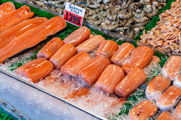 Fresh salmon fillets on fish stand in fish market at the Wharf Washington D.C