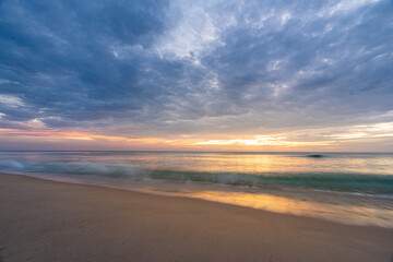Fototapeta na wymiar Beautiful sunset at famous Natai beach in Phang nga, southern part of thailand close to Phuket.