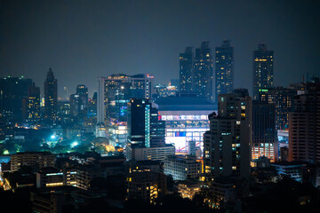 Fototapeta na wymiar Bangkok skyline view at night from a rooftop restaurant, Bangkok Thailand