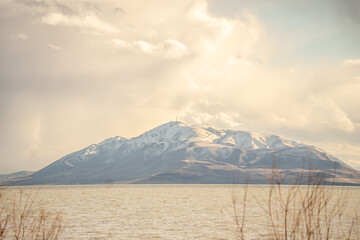 Snow Capped Mountains in Distance Over Utah Lake
