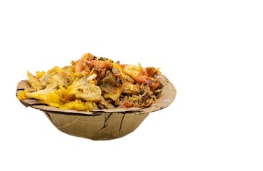Papri Chat or Papri Chaat Garnished with Chili, Onion Cuts, Tomato Sauce and Spices in a Dry Leaves Disposable Bowl Isolated on White Background with Copy Space, Indian Street Food