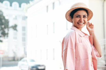 Young beautiful smiling hipster woman in trendy summer pink costume clothes. Carefree female posing...