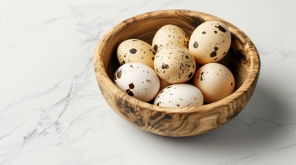 Naklejka na ściany i meble Raw quail egg in wooden bowl isolated on white background with full depth of field. Top view.