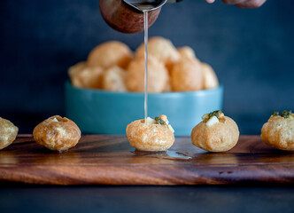 Crispy-fried puffed balls filled with potato and chickpeas © sandalphonarts