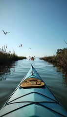 a view from the front of a kayak on a river - obrazy, fototapety, plakaty
