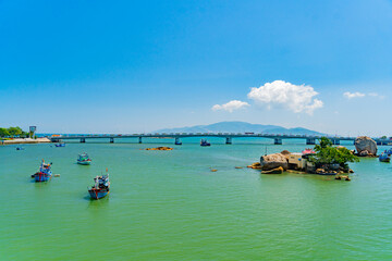 The city bridge over the river.
The Kai River in Nha Trang in Vietnam. The urban landscape.