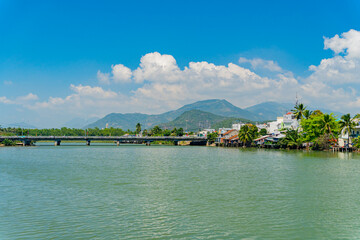 The city bridge over the river.
The Kai River in Nha Trang in Vietnam. The urban landscape.