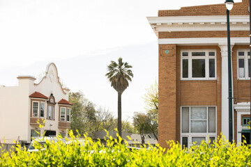 Tracy, California, USA - April 17, 2023: Afternoon sun shines on historic downtown buildings along...