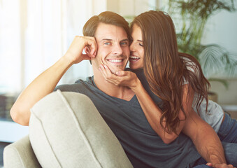 Smile, portrait and couple relaxing on sofa for bonding in living room at apartment together. Happy, resting and young man and woman laying on couch for romance and marriage in lounge at modern home.