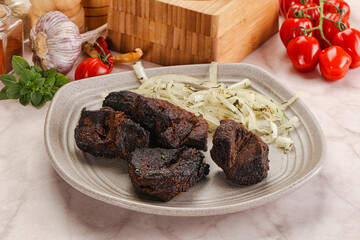 Grilled beef barbecue served onion