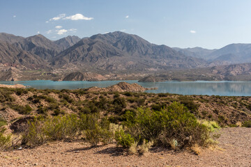 Beautiful view to andean mountain range and lake near Mendoza