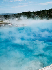 Turquoise water of Excelsior Geyser steaming at Yellowstone