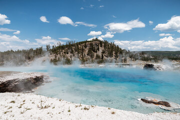 Turquoise water steaming in Excelsior geyser in Yellowstone Nati
