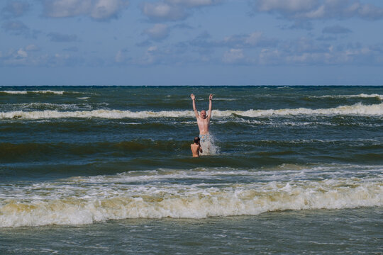Son and father at the sea