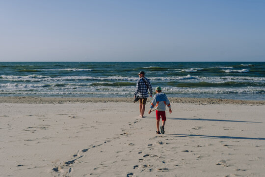 Father and son at the summer beach