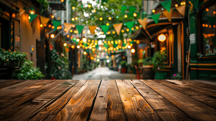 A wooden empty tabletop adorned with festive green garlands and St. Patrick's Day flags.