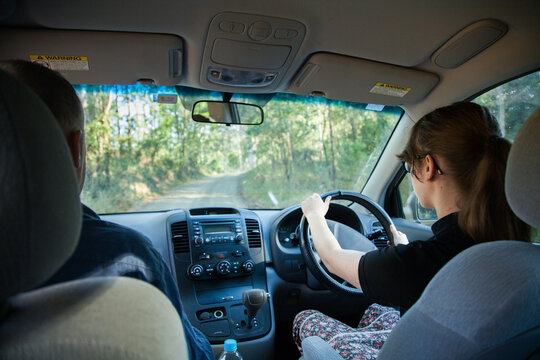 Learner driver getting experience on narrow gravel road in the country