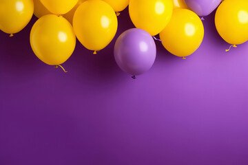 Yellow air balloons on a violet studio background with copy space.