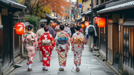 A group of Japanese women in colorful kimonos walking on an old street in Kyoto