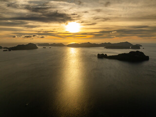 Fototapeta na wymiar Sunset and dusky clouds over the group of Islands in El Nido, Palawan. Philippines.