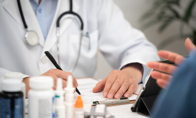 Close-up of a patient and a male doctor being consulted in a hospital