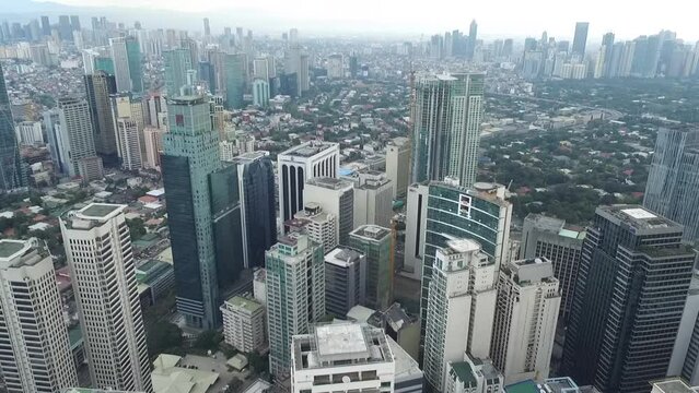 Manila Makati City in Philippines. Cityscape Skyline and Business Skyscrapers in Background. Manila Business District Traffic.