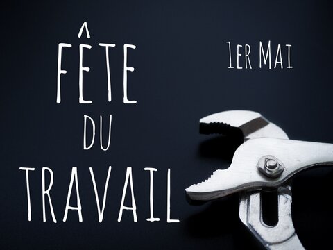 International worker's day background. Adjutable pliers and french text f&eacute;te du travail 1er mai