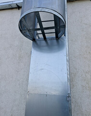  fire ladder leading to the roof of the hall is secured by a grille in the lower part of the...